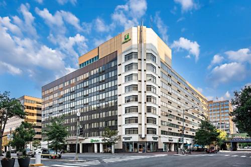 a tall white building on a city street at Holiday Inn Washington Capitol-National Mall by IHG in Washington, D.C.