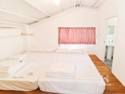 Postel nebo postele na pokoji v ubytování 埔里福興宣安獨棟民宿