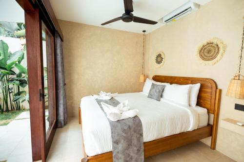 Postel nebo postele na pokoji v ubytování Villa Akuta