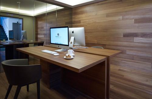 an office with a desk with a computer on it at Samaria Hotel in Chania Town