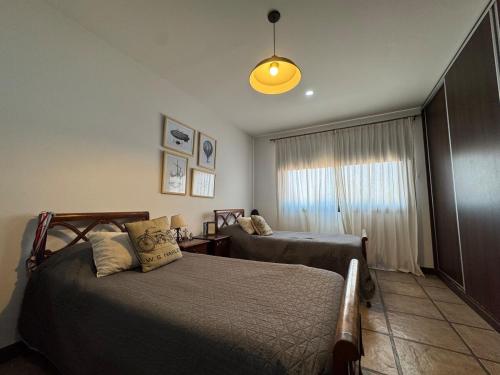 Una cama o camas en una habitación de Casa de Campo Nature Families