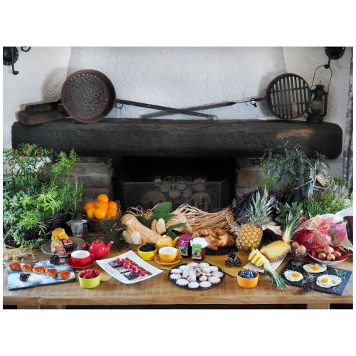 a table with a bunch of fruits and vegetables at Locanda Il Rustichello in Mulazzo