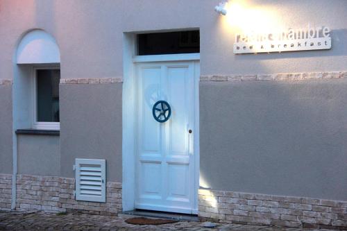 a white door on the side of a building at Relais Chambre in Castelfidardo
