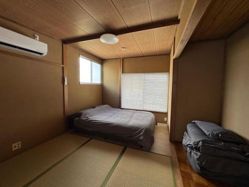 Ένα ή περισσότερα κρεβάτια σε δωμάτιο στο BlueTree稲取