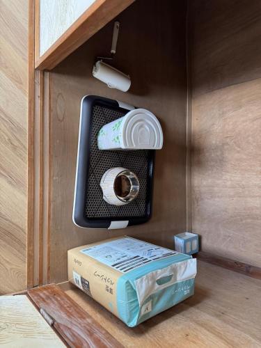 a box with a roll of paper in a drawer at BlueTree稲取 in Higashiizu