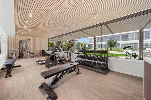 a gym with cardio equipment in a building at Casa Oasis Beachfront at Bokarina in Bokarina