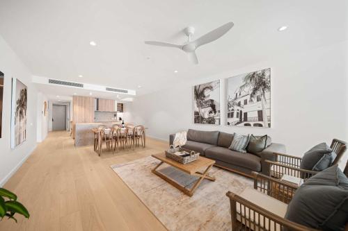 a living room with a couch and a table at Casa Oasis Beachfront at Bokarina in Bokarina