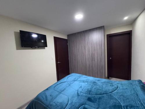 Ein Bett oder Betten in einem Zimmer der Unterkunft casa en cuenca full equipada