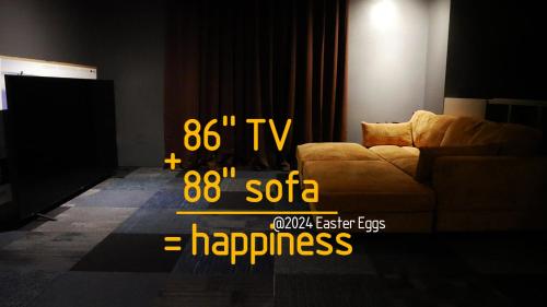 a living room with a couch and a television at Easter Eggs in Rochester