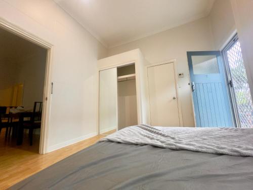 a bedroom with a bed and a large window at Studio room ensuite bathroom Brisbane City near Kangaroo Point and Gabba Cricket stadium in Brisbane