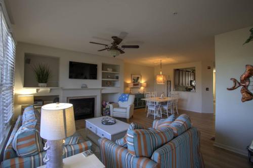 a living room with couches and a living room with a fireplace at 128E October Glory Ave, Ocean View in Ocean View