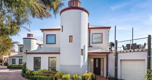 a house with a lighthouse on top of it at Chapel Street Lighthouse in Cowes