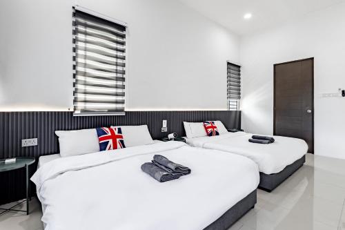 Ένα ή περισσότερα κρεβάτια σε δωμάτιο στο i Homes Villa 3 Nearby Sunway - Swimming Pool and Karaoke