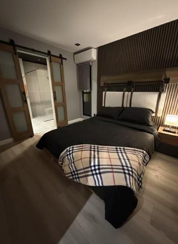 a bedroom with a large bed with a large bedspread at Zenity Joshua tree in Joshua Tree