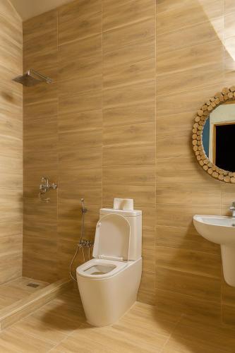 a bathroom with a toilet and a sink at Soléi Desert Retreat in Siwa