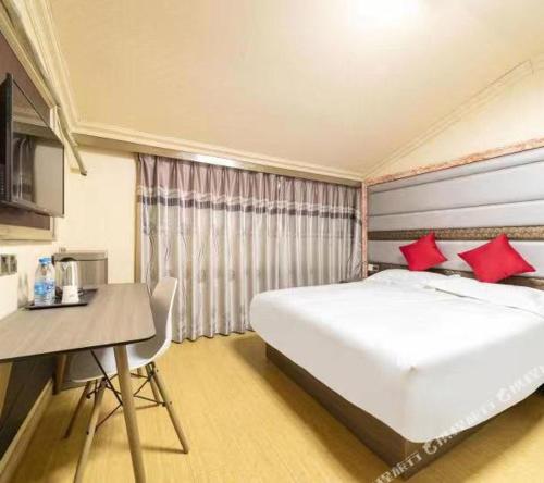 Ένα ή περισσότερα κρεβάτια σε δωμάτιο στο Shanghai Yujia Hotel