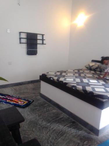 Ένα ή περισσότερα κρεβάτια σε δωμάτιο στο Batawala PARADIES inn