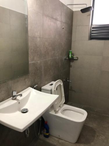 a bathroom with a sink and a toilet at Viyathpura in Nikawatawana