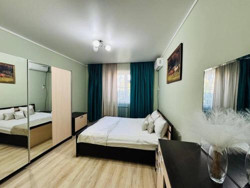a bedroom with two beds and a mirror at Guesthouse Gorilla 