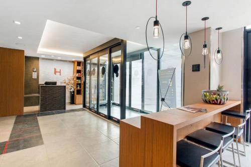 a kitchen with a table and chairs in a building at Insignia Hotel Brooklyn, an Ascend Collection Hotel in Brooklyn