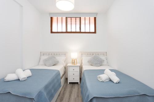 Ένα ή περισσότερα κρεβάτια σε δωμάτιο στο Apartment Beautiful Sea View Las Vistas