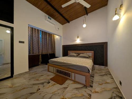 Ένα ή περισσότερα κρεβάτια σε δωμάτιο στο Kaveen Homes