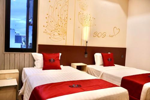 Ένα ή περισσότερα κρεβάτια σε δωμάτιο στο BOB Hotel Cần Thơ