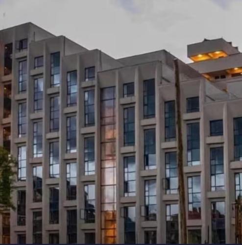a tall building with many windows on it at CK place in Nairobi