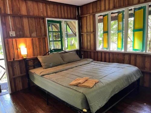 A bed or beds in a room at AoPong Resort