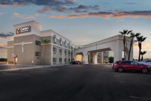 a hotel with cars parked in a parking lot at Comfort Inn & Suites Surprise Near Sun City West in Surprise