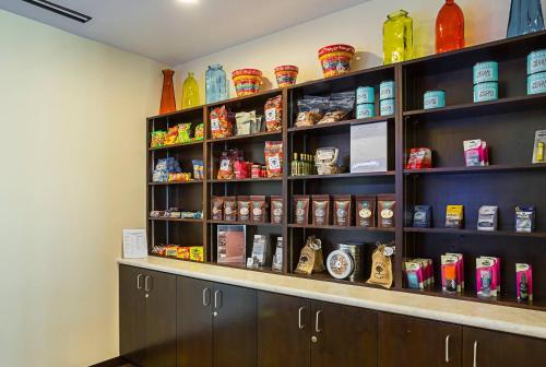 a shelf filled with lots of different types of food at The Hotel at Sunland Park Casino El Paso, an Ascend Collection Hotel in El Paso