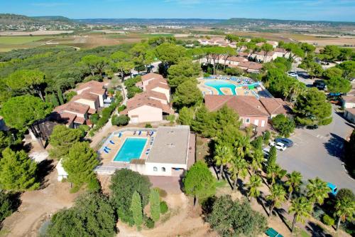 an aerial view of a home with a swimming pool at Panorama du mas, 2 Pers Piscine à Calvisson in Calvisson