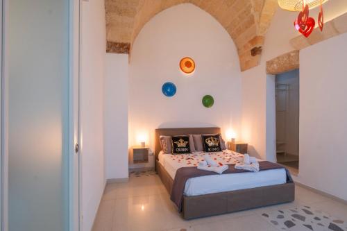 a bedroom with a large bed in a room at Nuvò-Lux e Spa in Veglie