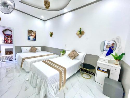 Un ou plusieurs lits dans un hébergement de l'établissement Hoàng Nga 1 Homestay