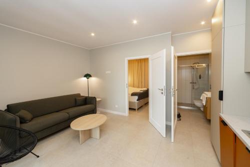 a living room with a couch and a table at Słoneczna in Sieraków