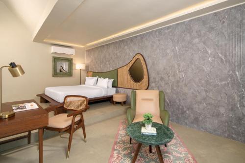 Ένα ή περισσότερα κρεβάτια σε δωμάτιο στο Treat Aranya Resort Kumbhalgarh