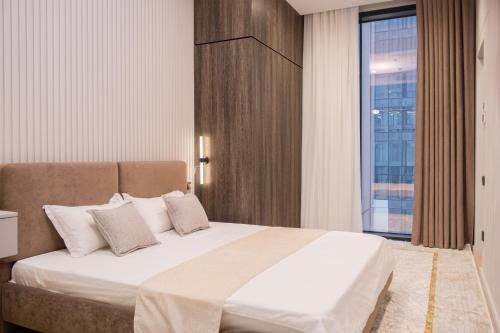 Postel nebo postele na pokoji v ubytování Nest One Downtown View, Элитные апартаменты с панорамным видом на город 207