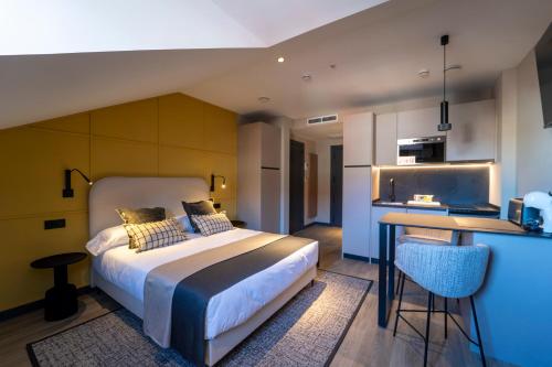 Voodi või voodid majutusasutuse Heritage Suites Oviedo toas