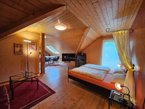 a bedroom with a large bed in a room at Das blaue Haus in Pleisweiler-Oberhofen