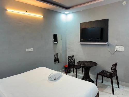 Μια τηλεόραση ή/και κέντρο ψυχαγωγίας στο Townhouse Preet Vihar Delhi