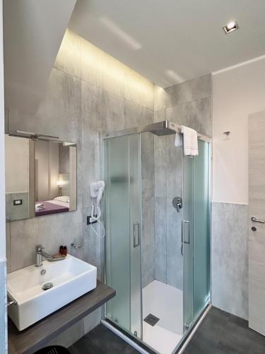a bathroom with a shower and a sink at B&B Margherita in Messina