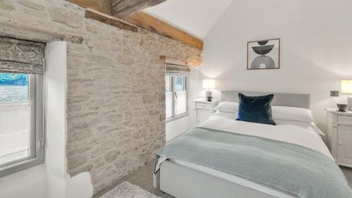 Voodi või voodid majutusasutuse Dotty's Cottage toas