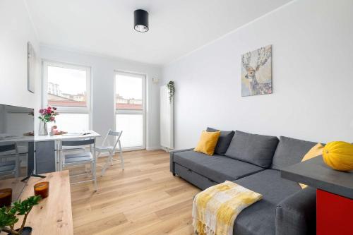 Red and Grey Apartment for 8 People in Poznań with Parking by Noclegi Renters