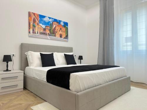 a bedroom with a large bed in a room at Amelia House in Bologna