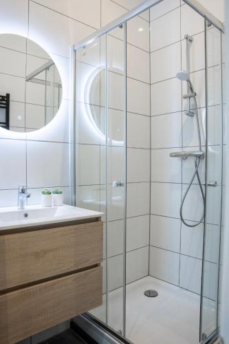 a bathroom with a shower and a sink at Spacious Apartment in Tilburg Bed and Coffe in Tilburg