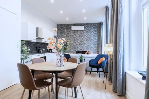 a kitchen and dining room with a table and chairs at Spacious Apartment in Tilburg Bed and Coffe in Tilburg