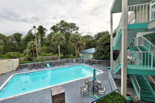 an image of a swimming pool at a hotel at Hotel Carolina - Standard King Room in Hilton Head Island