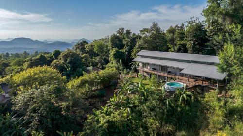 an aerial view of a house in the middle of a forest at Ella Nine Peaks in Ella