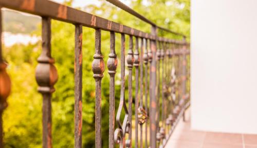 a row of metal fence on a walkway at Apartmani Kastel in Banja Luka