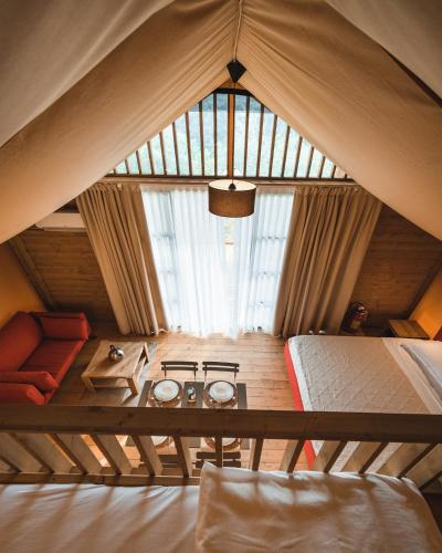 a room with a tent with a stove in it at Glamping Poggio Nardini in Montelupo Fiorentino